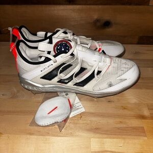 adidas White Baseball Cleats with Black Stripes and Neon Orange Pull Tabs